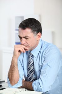 Man thinking at desk