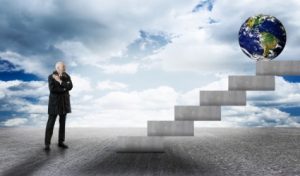 businessman-facing-stairs-with-earth-globe - path to success