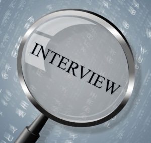 interview-magnifier-shows-research-conference-and-interviewed