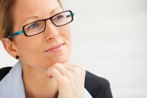 woman with glasses - reflecting