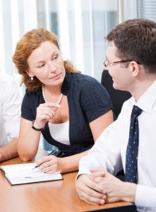 Requesting Salary Increase_business woman and professional man speaking