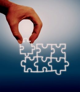 collaborating-hand-assembling-virtual-puzzle