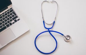 wellness-programs-laptop-and-stethescope