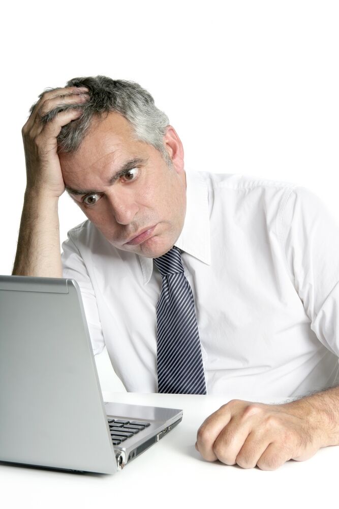 Asking for Help at Work_man confused at laptop