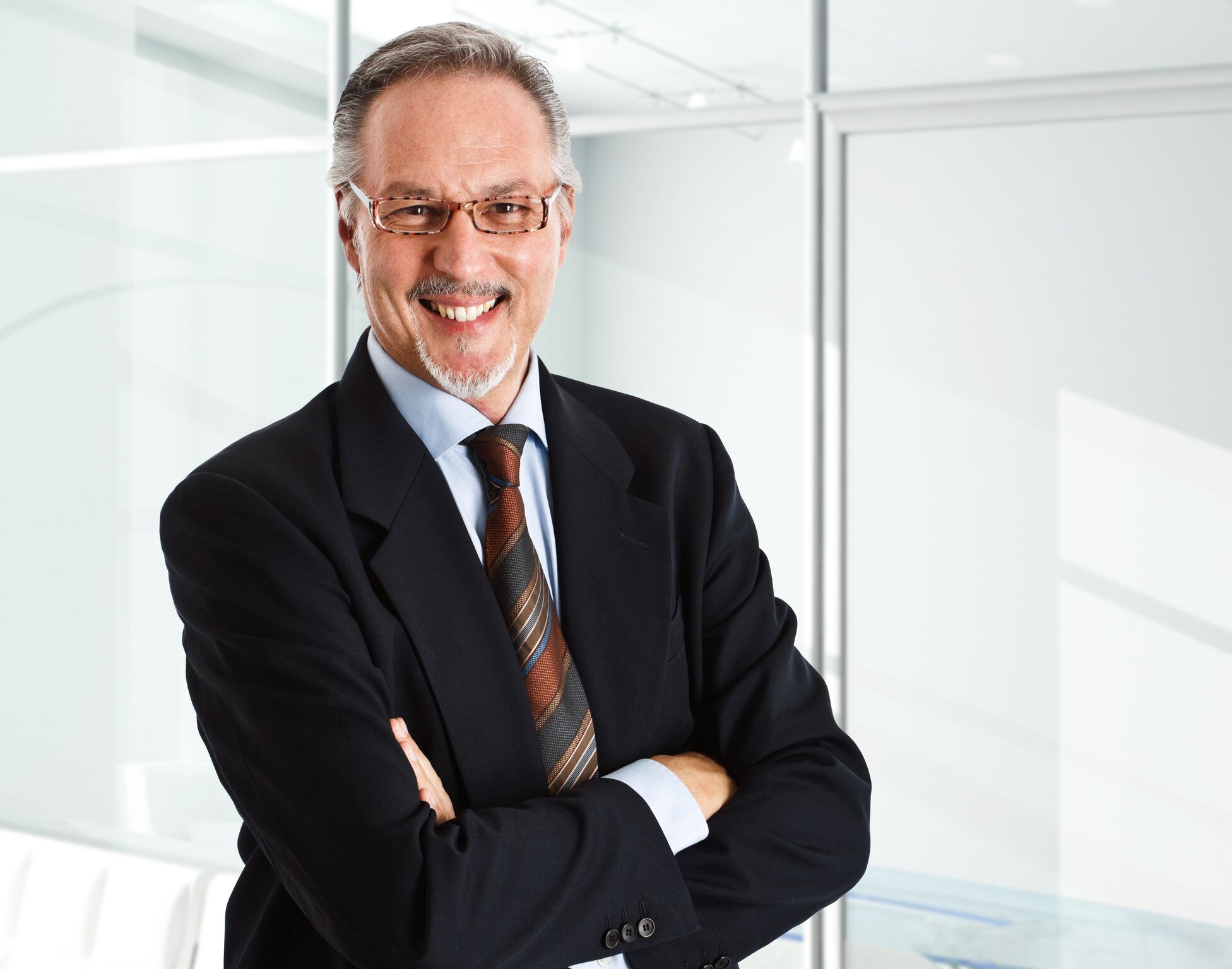 Corporate VP - business smiling outside glass office door