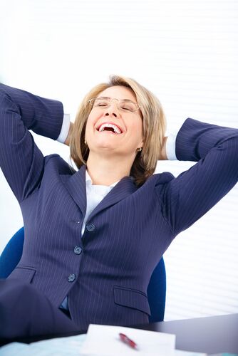 Resigning from your job - professional woman at desk_relieved