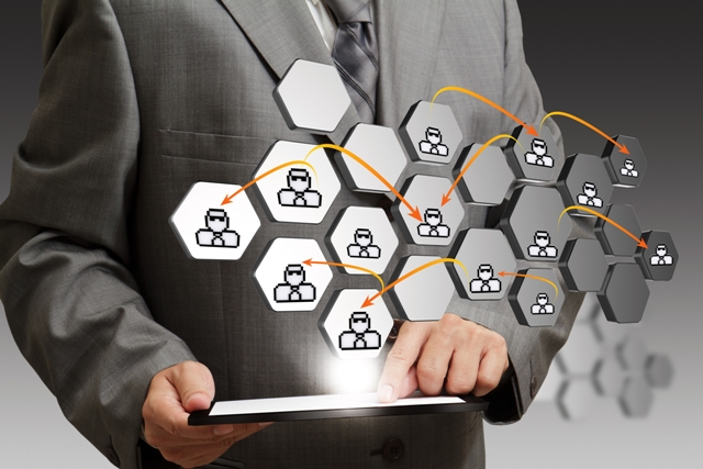 Executive Resumes - businessman holding tablet with network connections