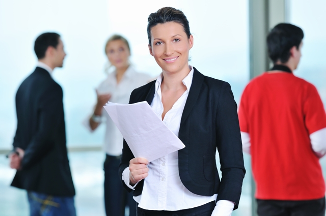 Advice from Female Business Leaders - Business Woman with papers - blurred background