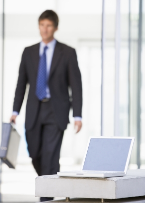 Worst times to quit your job - business man_defocused_with brief case_walking