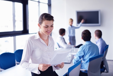 Humble-Mindset-and-Success-Professional-Woman-Reading-Paper-in-Conference-Room