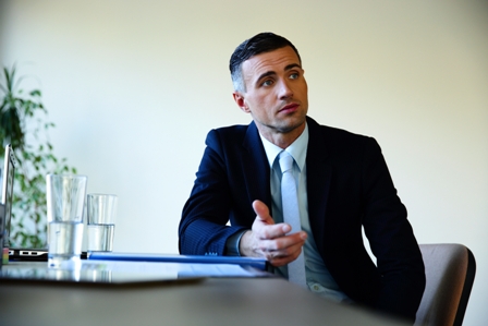 Laid-off-Business-Leaders-Professional-man-at-desk-with-laptop