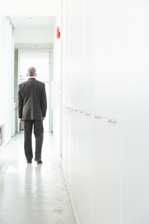 Job-Seeker-Man-in-suit-walking-down-hall.jpg