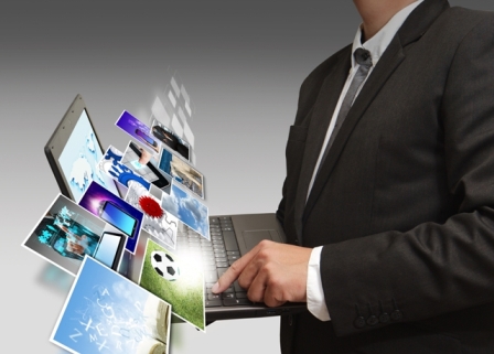 Business man holding his laptop