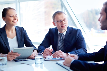 Business partners planning work and discussing ideas at meeting