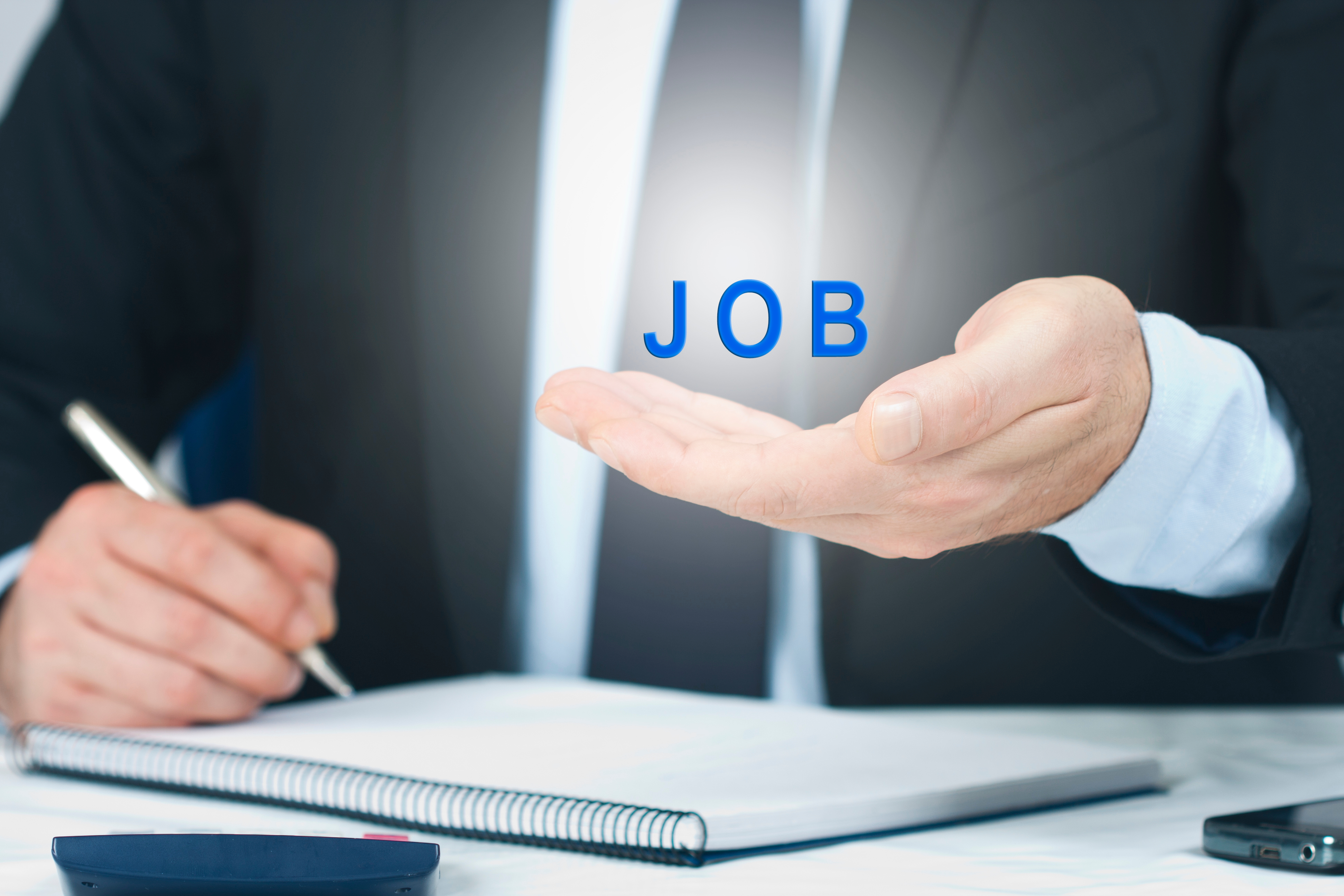 Employment Concept - executive writing holding word graphic_job_in hand