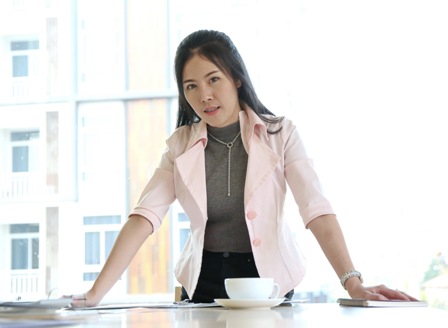 Empowering Female Entrepreneurs - businesswoman standing at desk