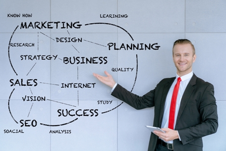 Presentation Tips - businessman standing in front of white board chart