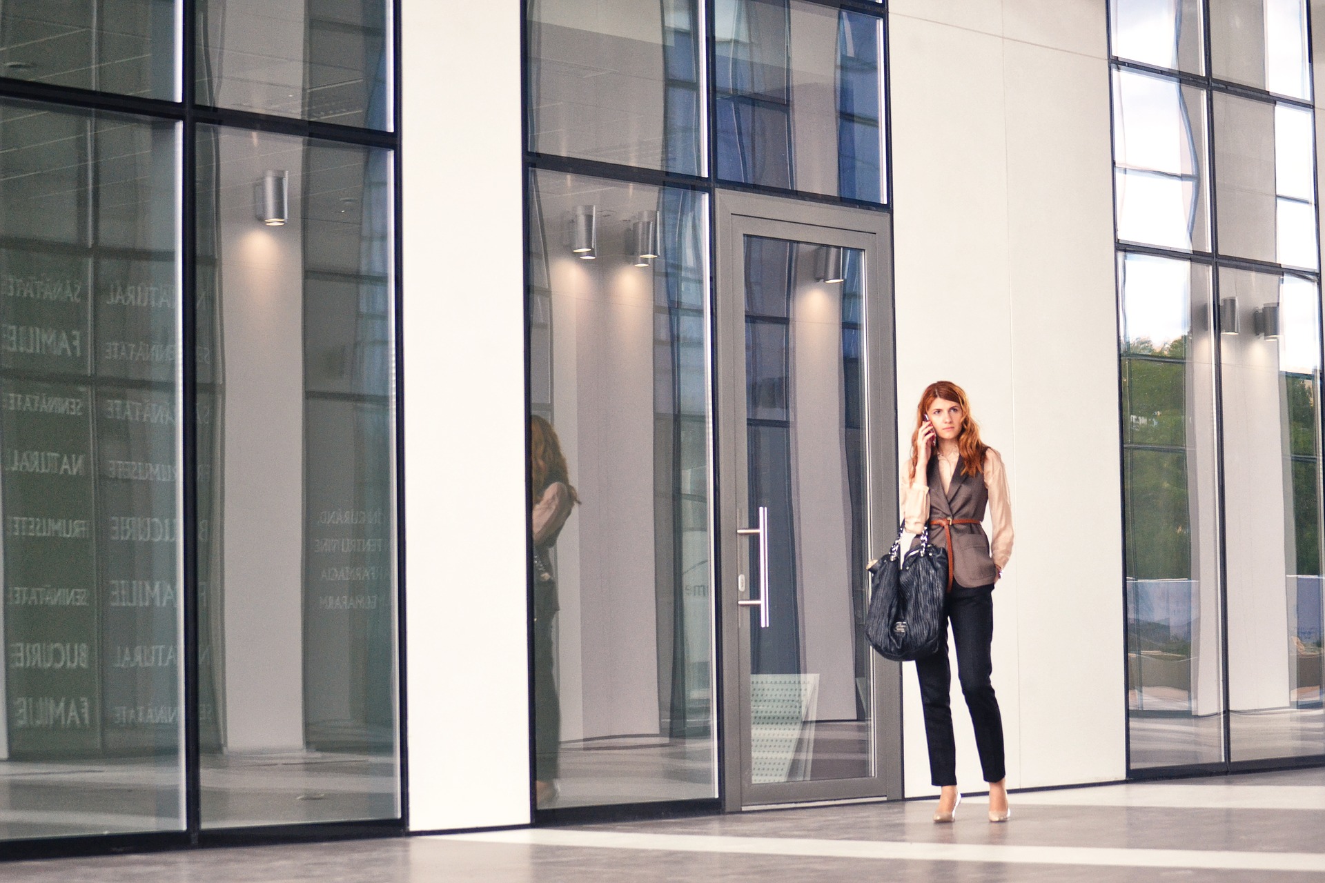 Counteroffers - business woman on phone in front of office building