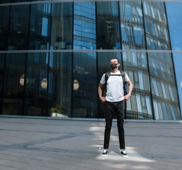 Masked worker outside office