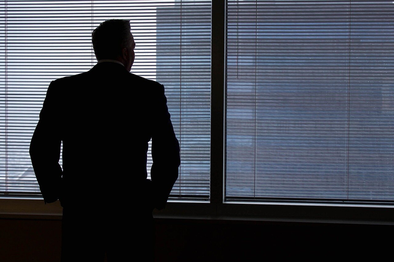 Businessman shadow in office