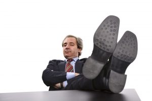 Man with feet on desk