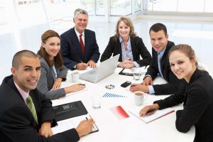nine-qualities-employers-seek-group-of-professionals-sitting-at-table