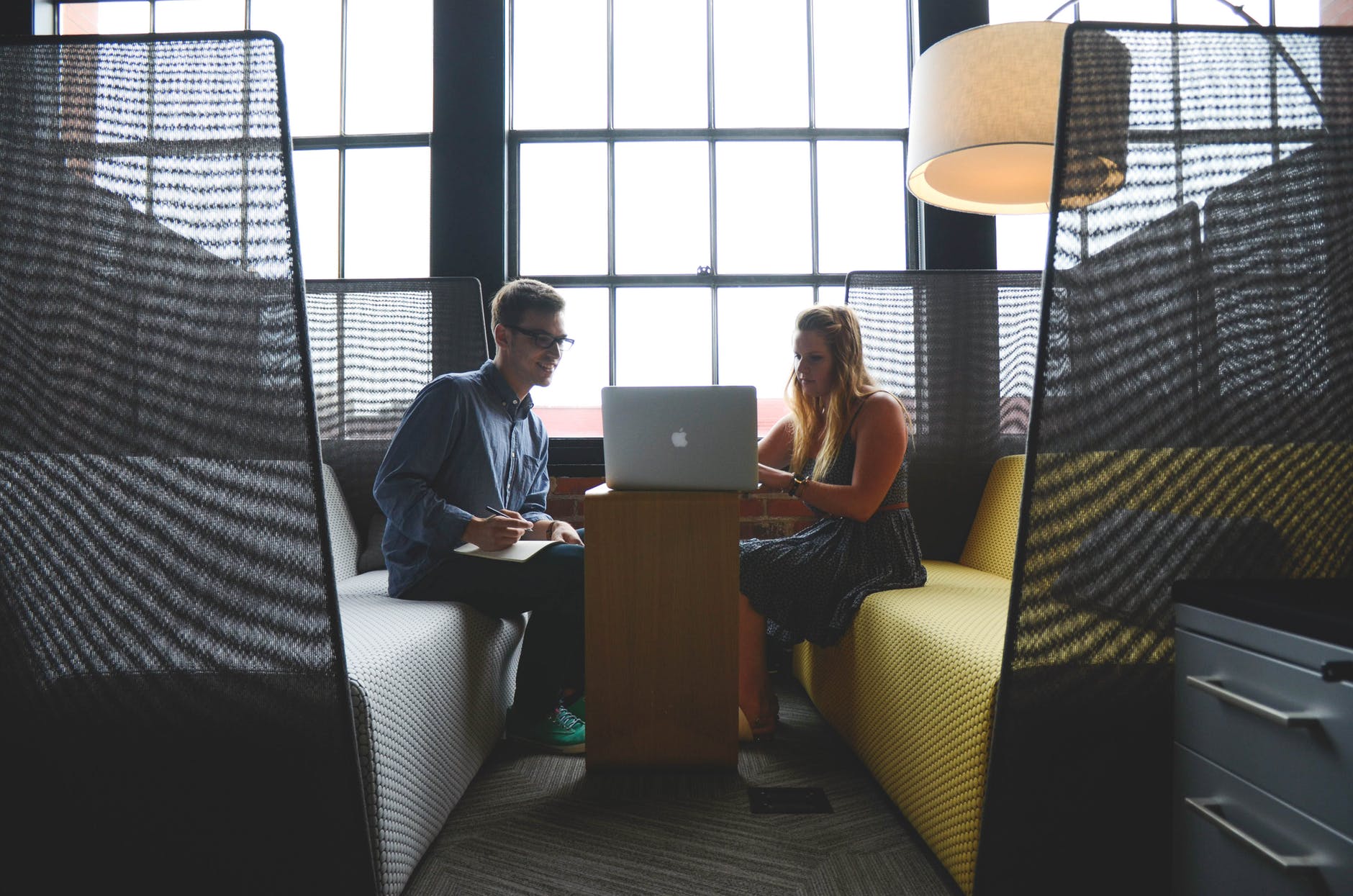 Artificial Intelligence - two people at laptop in room